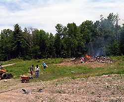 clearing the meadow and orchard area at the AQRT main center