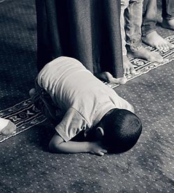 little boy prostrating