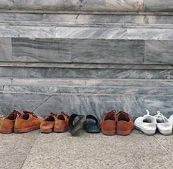 shoes lined up at a doorway